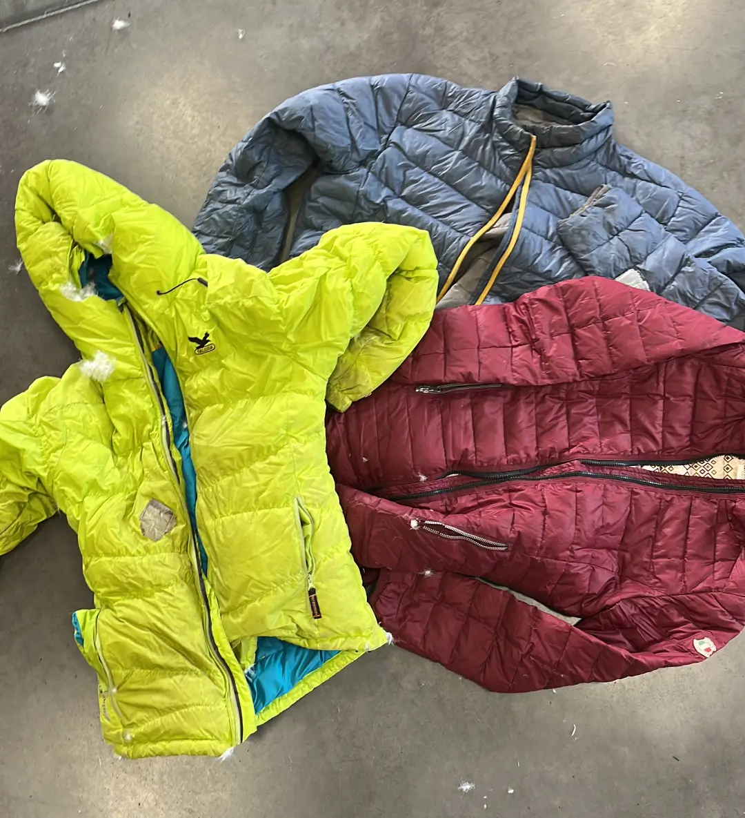 Post consumer puffer jackets ready for recycling